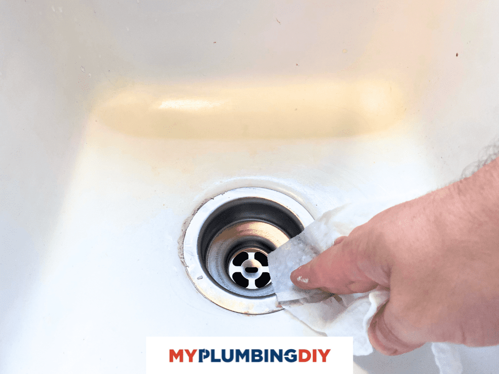 wipe off excess plumbers putty