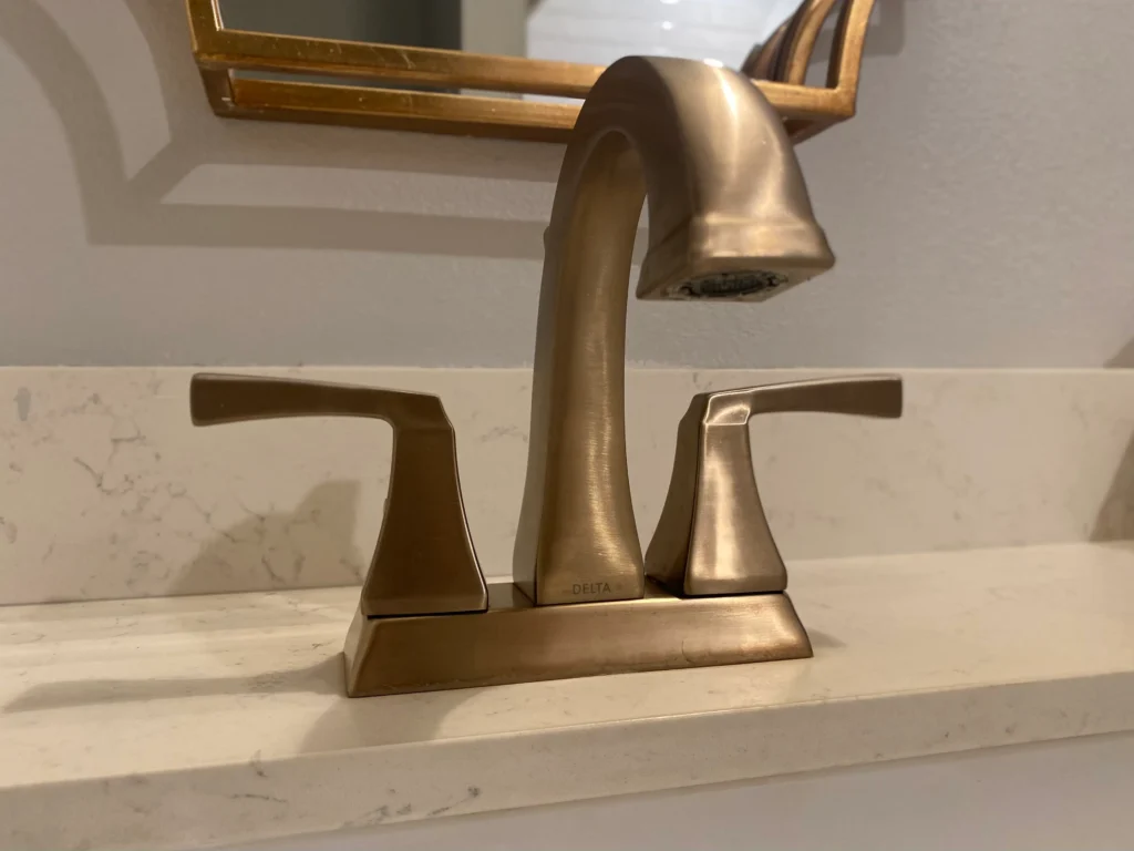 4 inch centerset gold Delta faucet