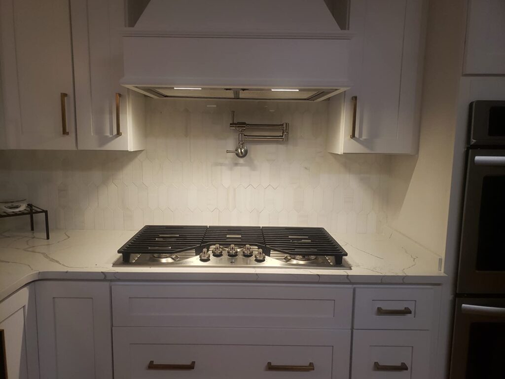 pot filler centered above stove top